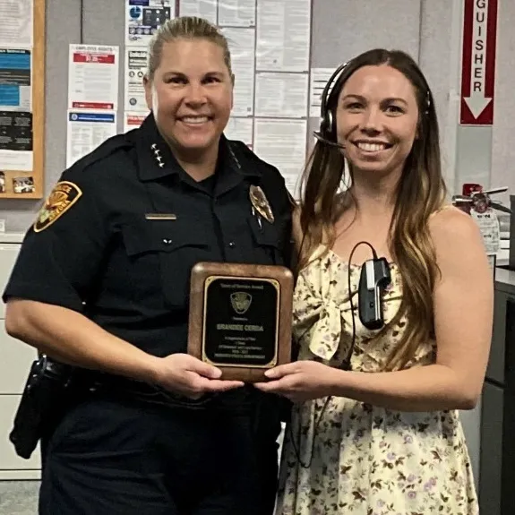 Chief Amy gives out an award from Prescott police