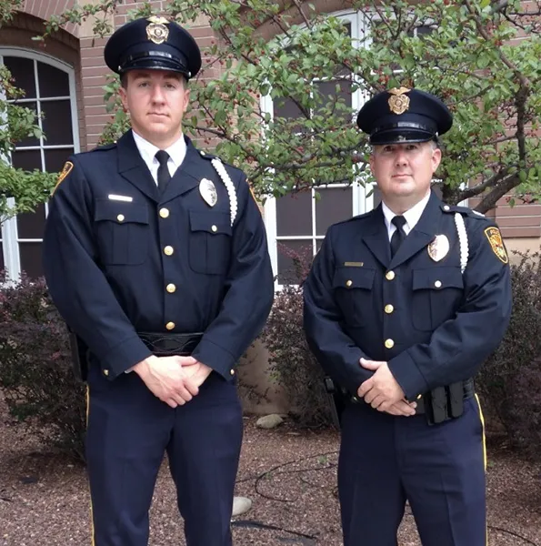 Two Prescott police officers in dress blues.