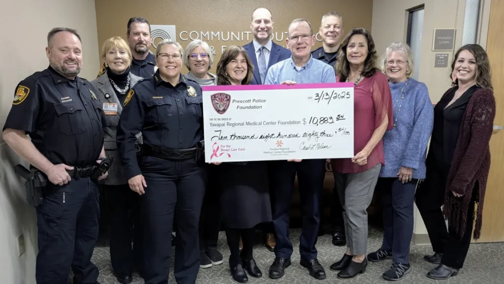 Prescott Police Foundation receiving a check.